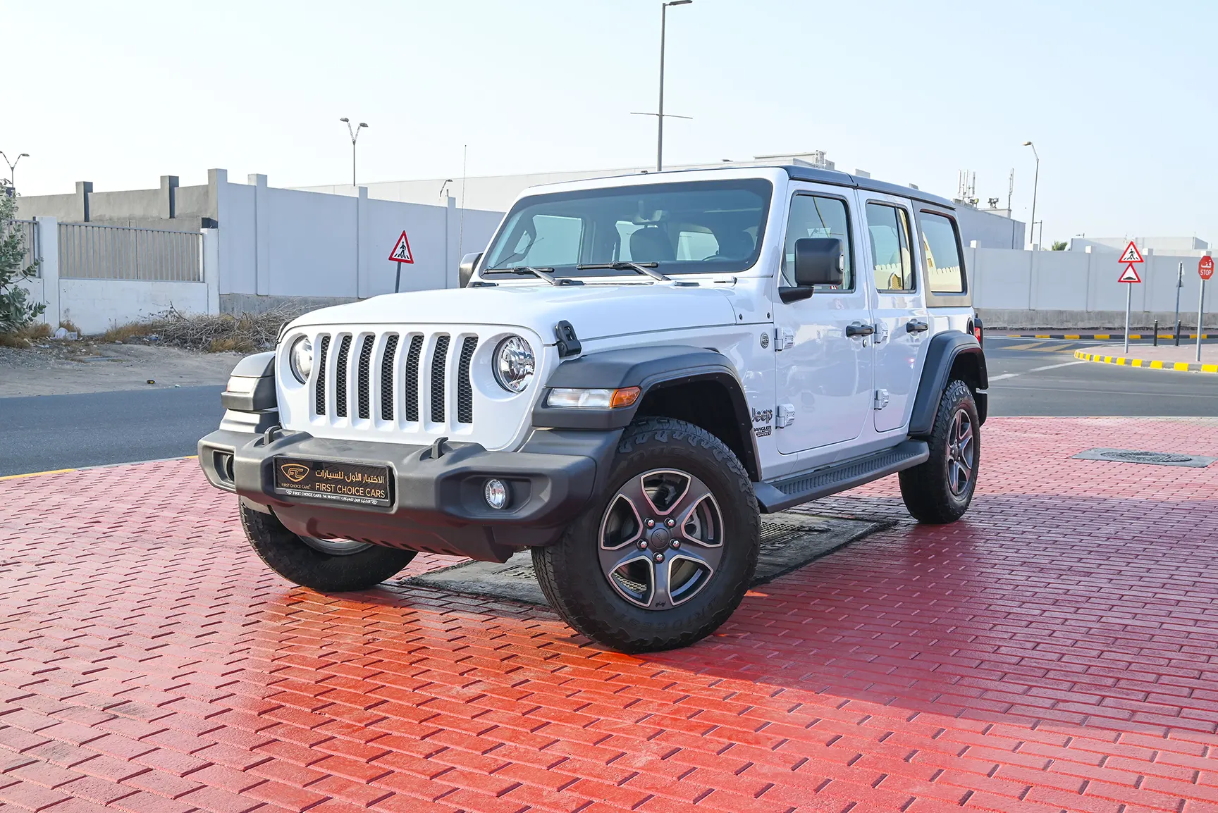 Used 2019 Jeep Wrangler Unlimited Sport White – Left Front Diagonal (45°) View at First Choice Cars Sharjah