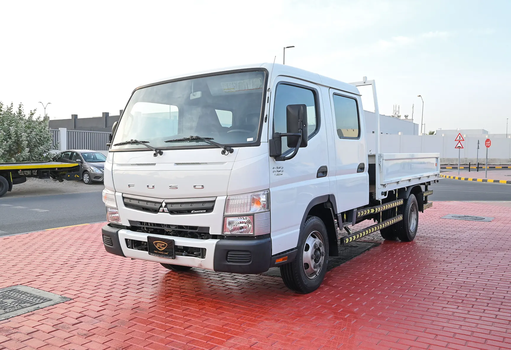 Used 2020 Mitsubishi Canter Double Cabin Cargo Body White – Left Front Diagonal (45°) View at First Choice Cars Sharjah
