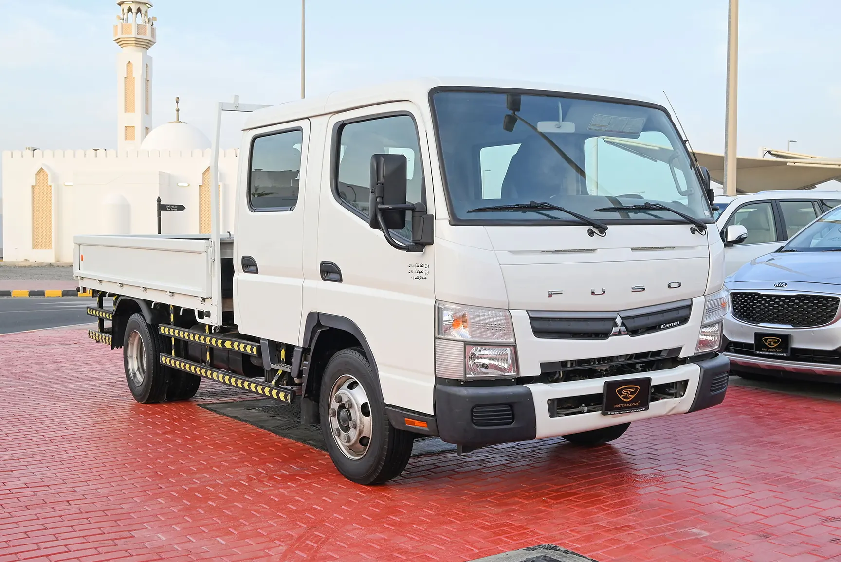Used 2020 Mitsubishi Canter Double Cabin Cargo Body White – Right Front Diagonal (45°) View at First Choice Cars Sharjah