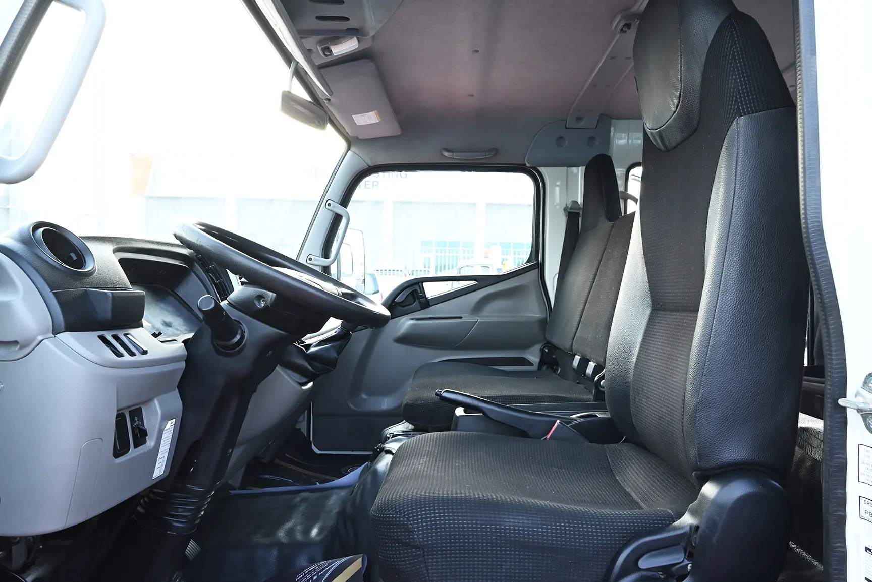 Used 2020 Mitsubishi Canter Double Cabin Cargo Body White – Front Driver Side Cabin View at First Choice Cars Sharjah