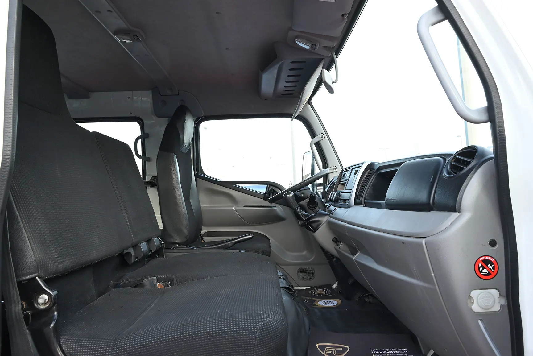 Used 2020 Mitsubishi Canter Double Cabin Cargo Body White – Front Passenger Side Cabin View at First Choice Cars Sharjah