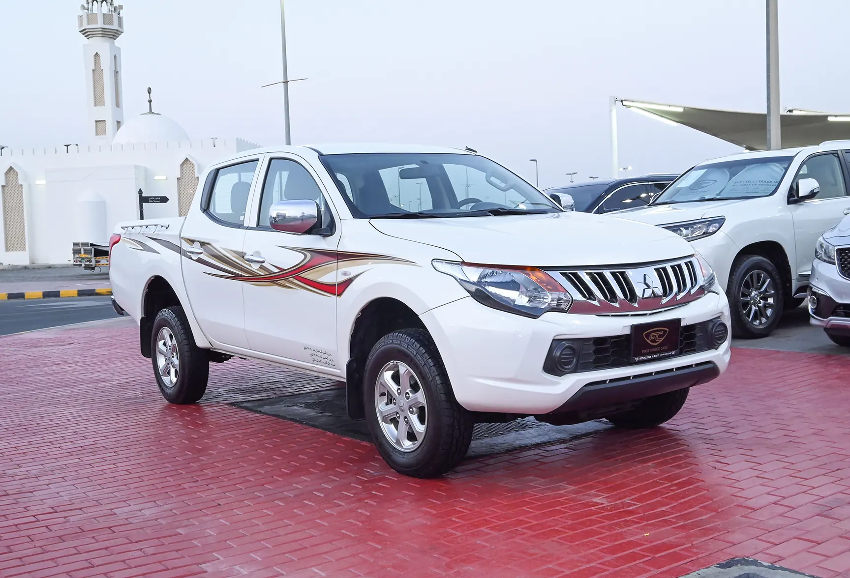 Used 2018 Mitsubishi L200 GL Double Cabin in White – Right Front Diagonal (45°) View for Sale at First Choice Cars Dubai Sharjah