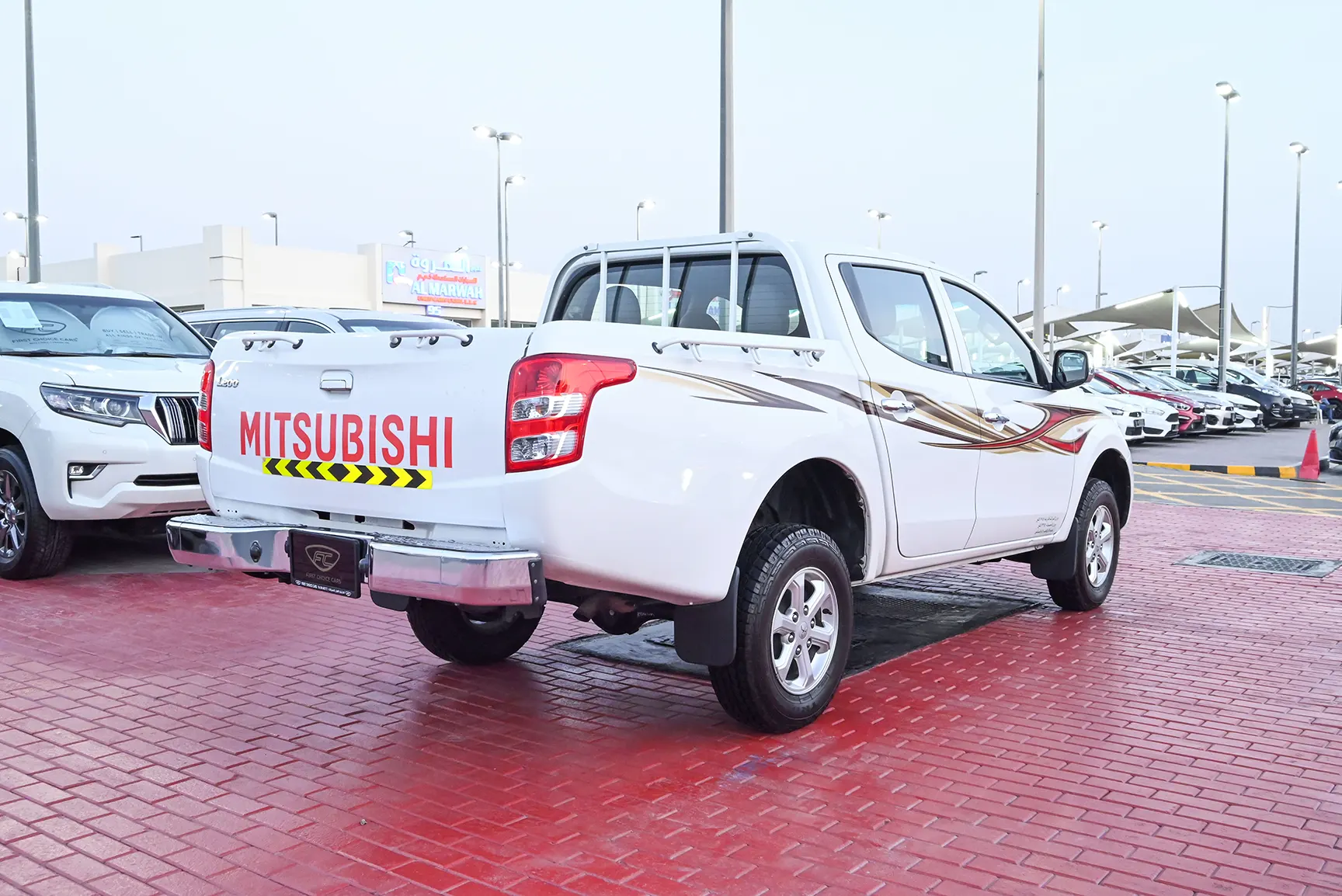 Used 2018 Mitsubishi L200 GL Double Cabin in White – Right Back Diagonal (45°) View for Sale at First Choice Cars Dubai Sharjah