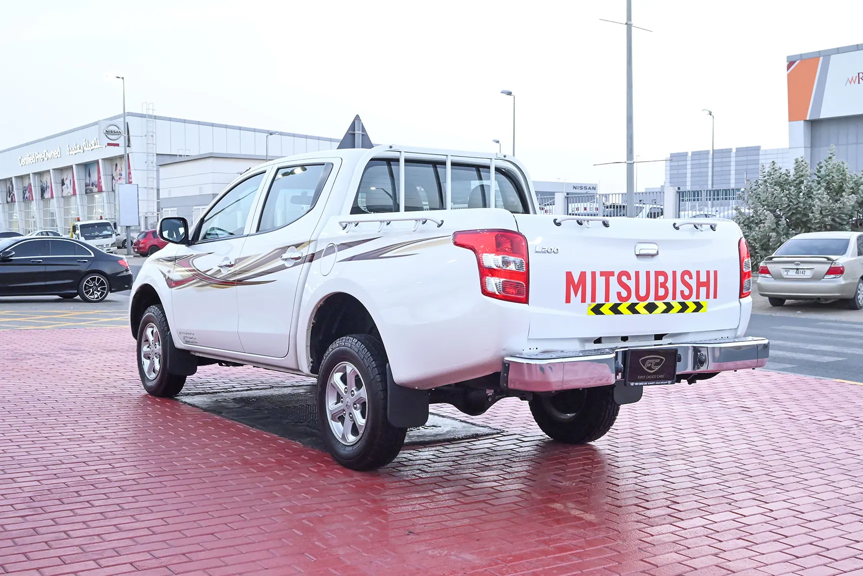 Used 2018 Mitsubishi L200 GL Double Cabin in White – Left Back Diagonal (45°) View for Sale at First Choice Cars Dubai Sharjah