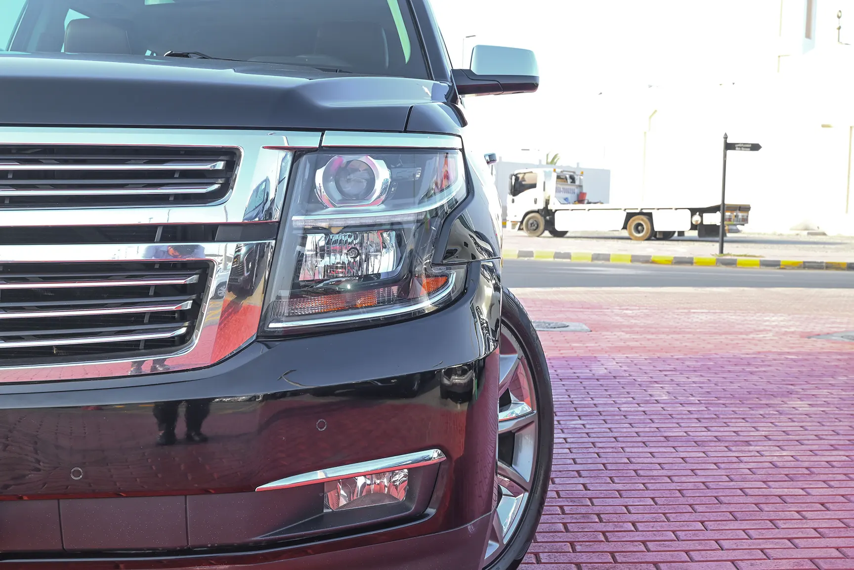 Used 2015 Chevrolet Tahoe LTZ Grey – Headlight Close-up at First Choice Cars Sharjah