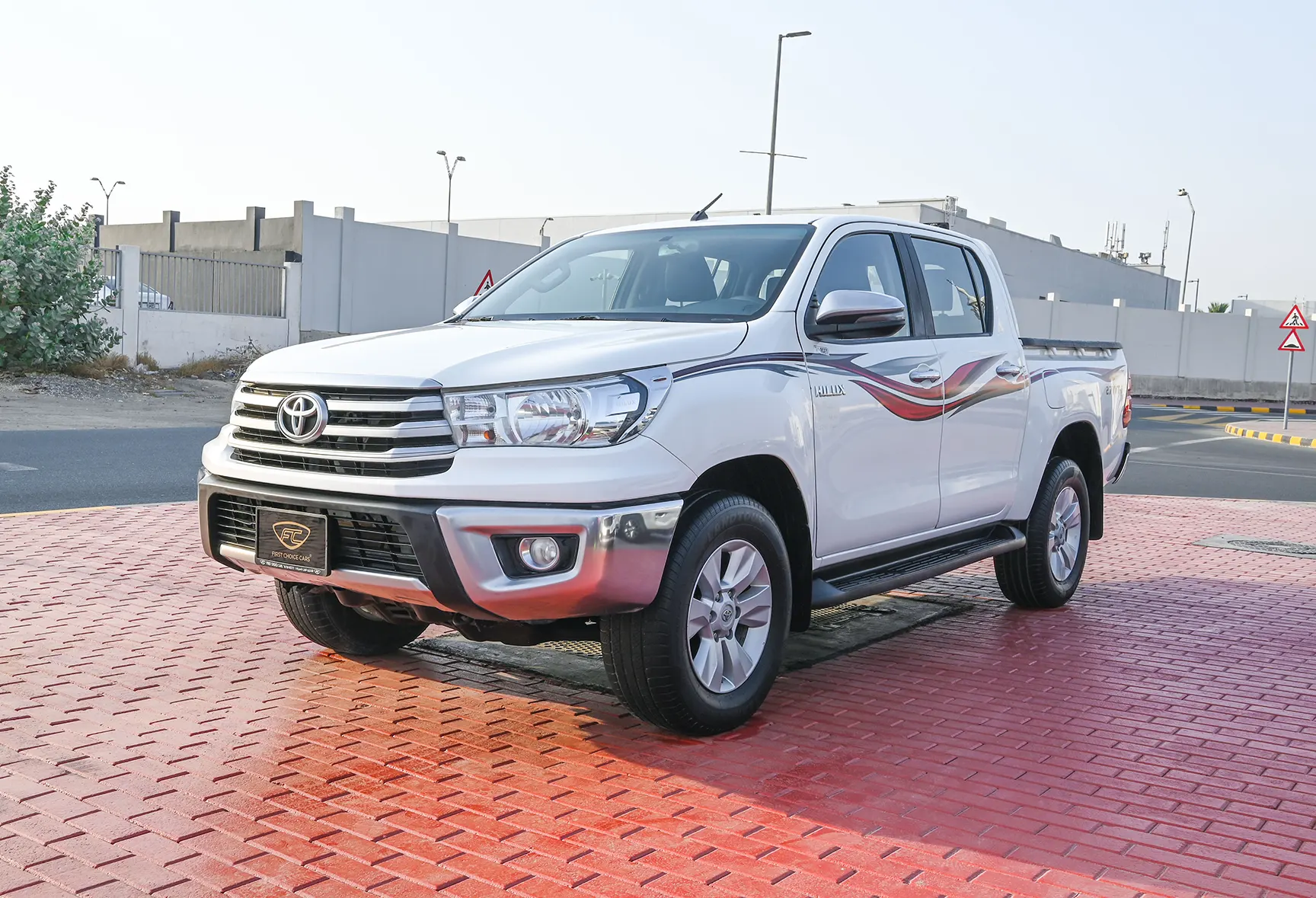 Used 2020 Toyota Hilux GLX Double Cabin White – Left Front Diagonal (45°) View at First Choice Cars Sharjah