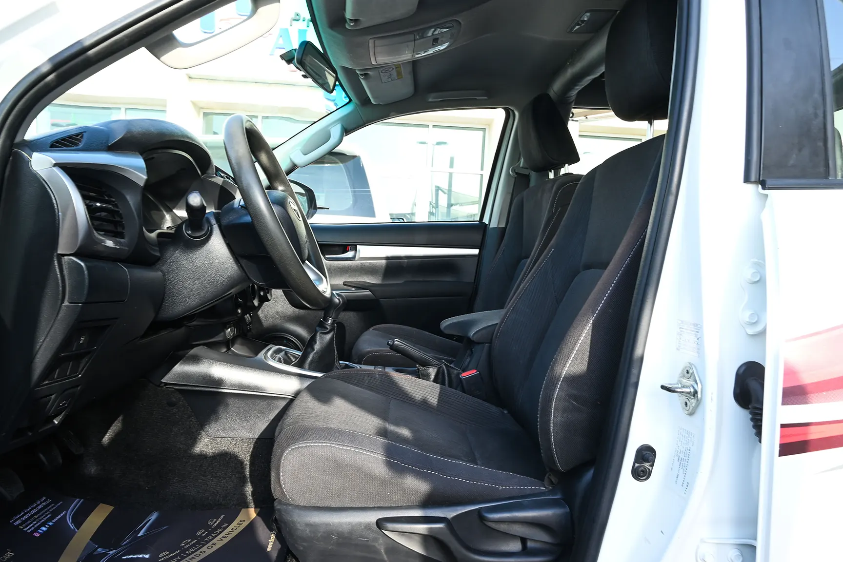 Used 2020 Toyota Hilux GLX Double Cabin White – Front Driver Side Cabin View at First Choice Cars Sharjah