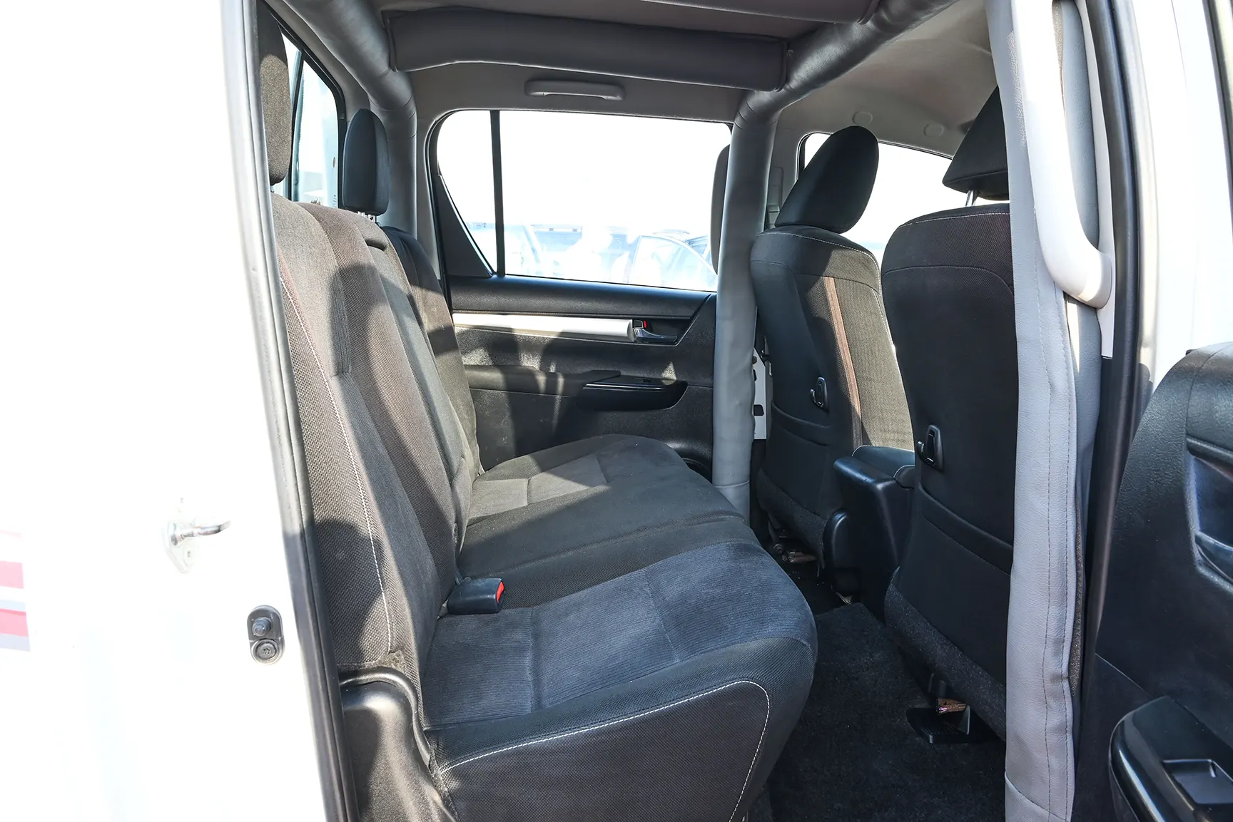 Used 2020 Toyota Hilux GLX Double Cabin White – Rear Passenger Side Cabin View at First Choice Cars Sharjah