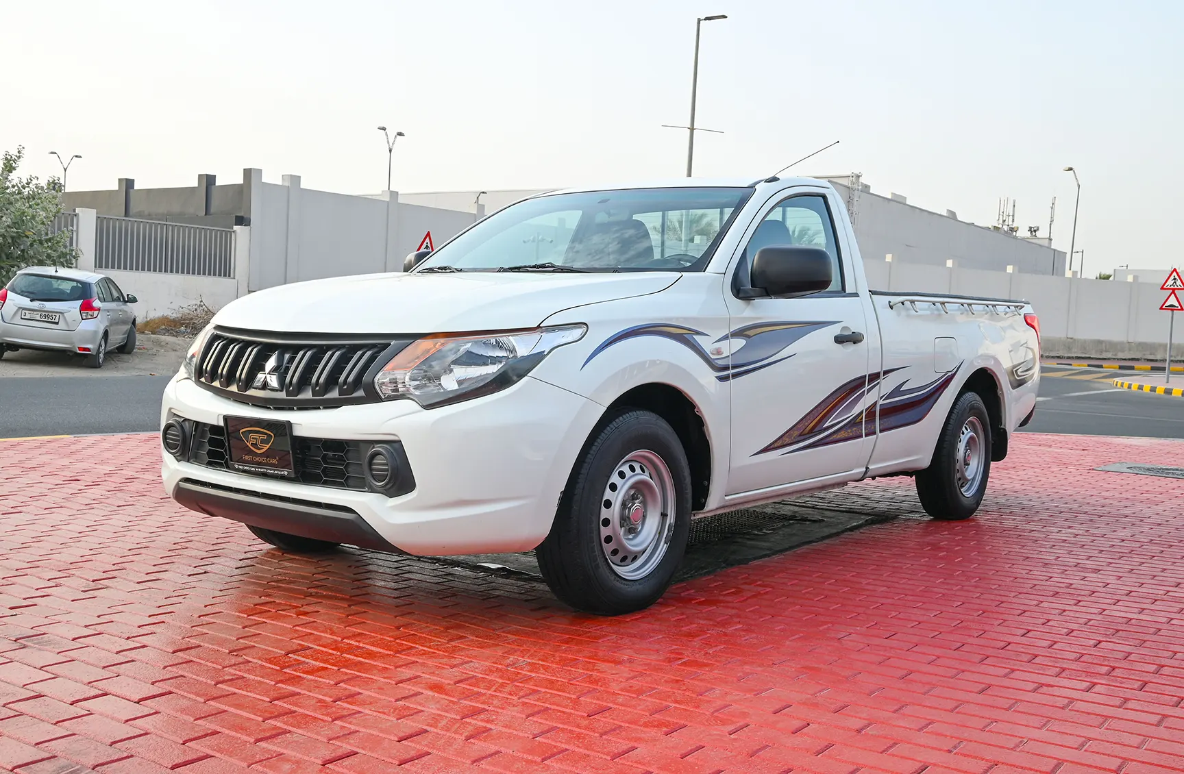 Used 2018 Mitsubishi L200 GL Single Cabin in White – Left Front Diagonal (45°) View for Sale at First Choice Cars Dubai Sharjah