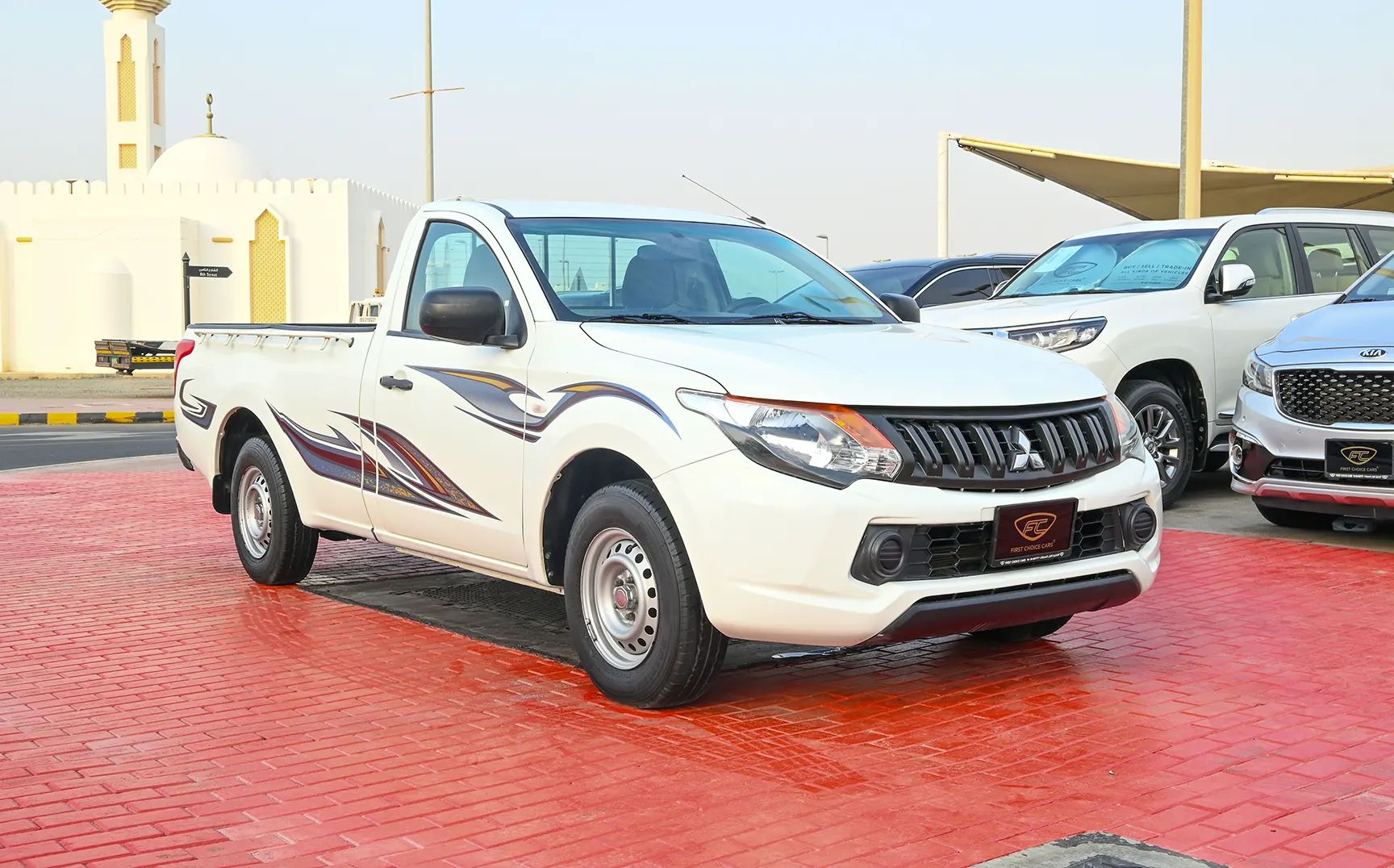 Used 2018 Mitsubishi L200 GL Single Cabin in White – Right Front Diagonal (45°) View for Sale at First Choice Cars Dubai Sharjah