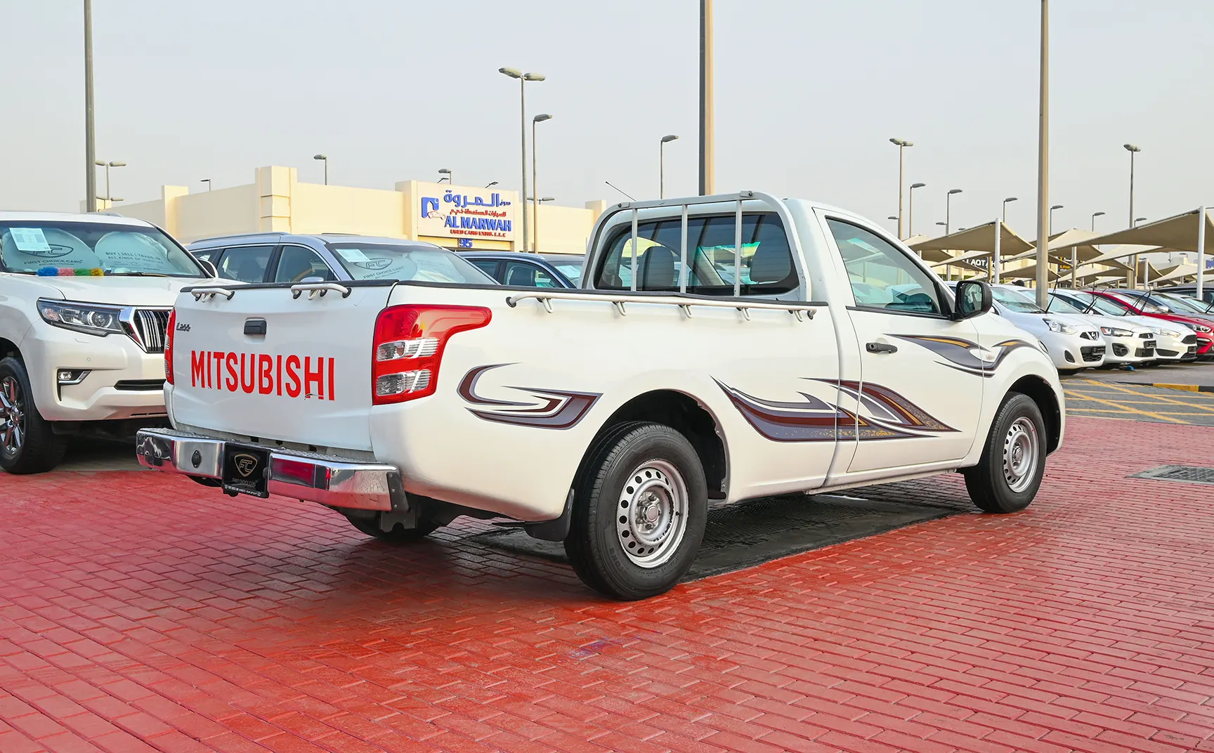 Used 2018 Mitsubishi L200 GL Single Cabin in White – Right Back Diagonal (45°) View for Sale at First Choice Cars Dubai Sharjah