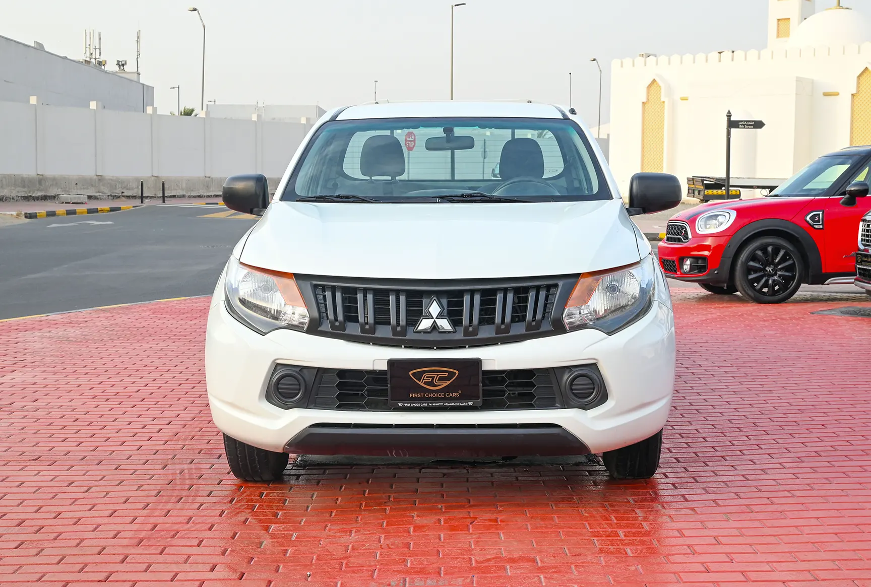 Used 2018 Mitsubishi L200 GL Single Cabin in White – Front View for Sale at First Choice Cars Dubai Sharjah