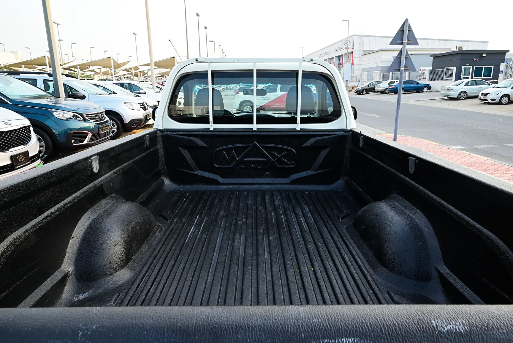 Used 2018 Mitsubishi L200 GL Single Cabin in White – Boot / Trunk Space Open View for Sale at First Choice Cars Dubai Sharjah