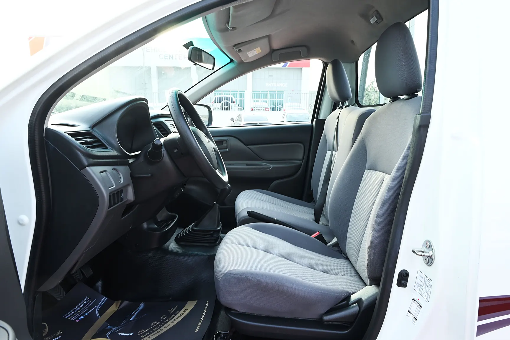 Used 2018 Mitsubishi L200 Single Cab GL White – Front Driver Side Cabin View at First Choice Cars Sharjah