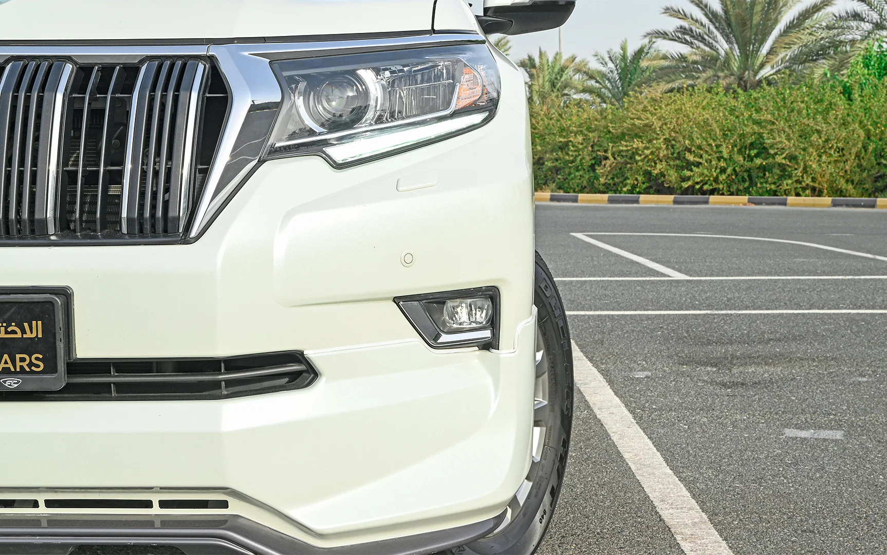 Used 2019 Toyota Prado VXR White – Headlight Close-up at First Choice Cars Sharjah