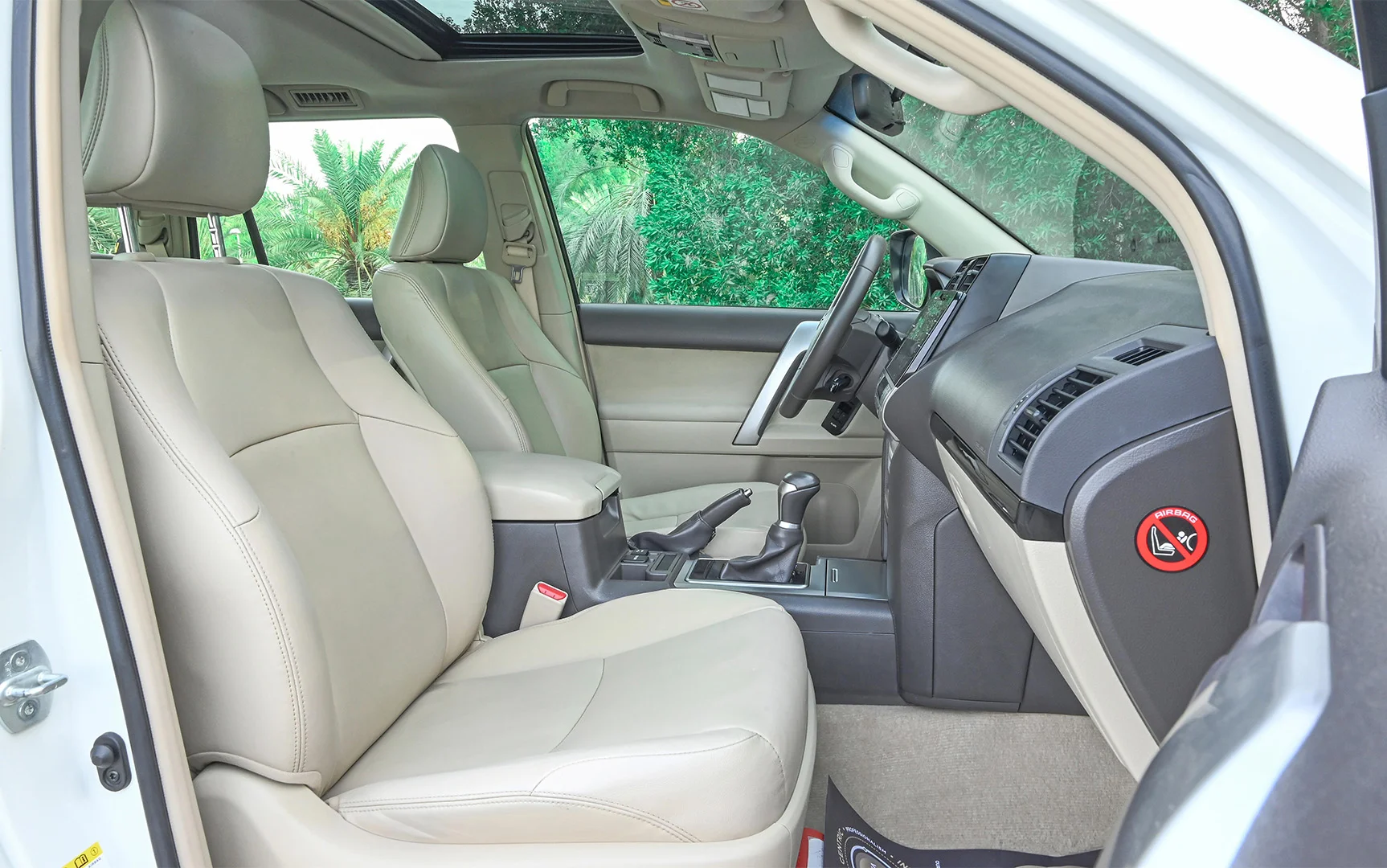 Used 2019 Toyota Prado VXR White – Front Passenger Side Cabin View at First Choice Cars Sharjah