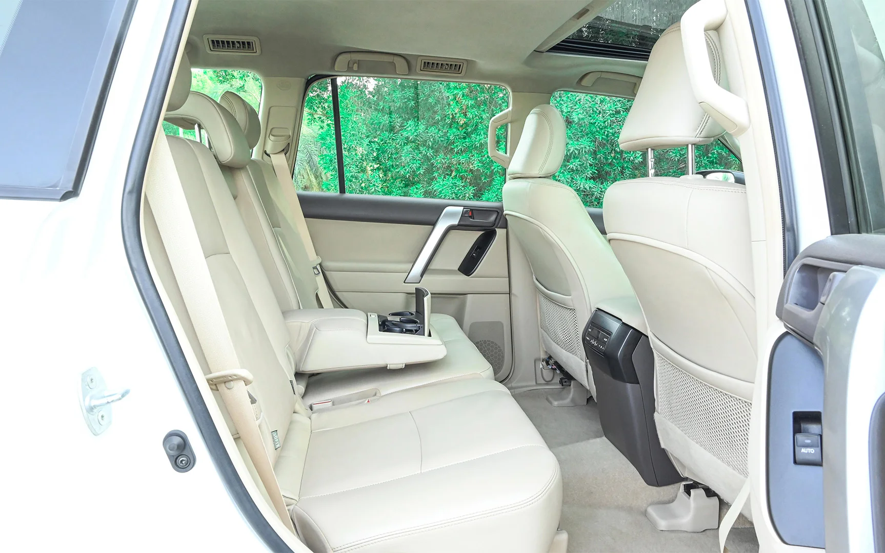 Used 2019 Toyota Prado VXR White – Rear Passenger Side Cabin View at First Choice Cars Sharjah