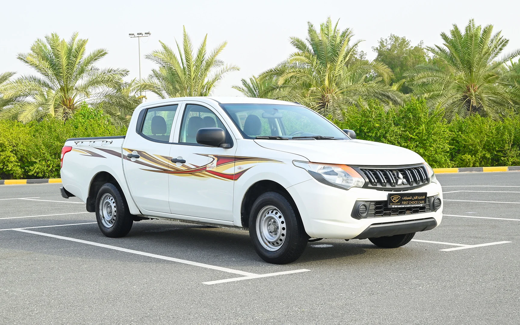 Used 2018 Mitsubishi L200 GL Double Cabin in White – Right Front Diagonal (45°) View for Sale at First Choice Cars Dubai Sharjah