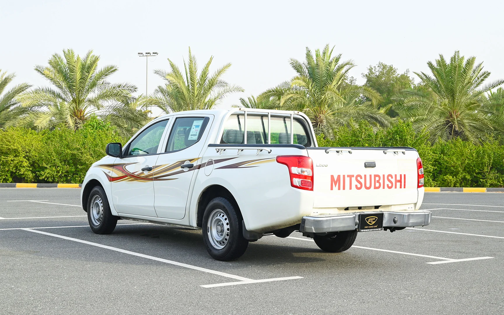 Used 2018 Mitsubishi L200 GL Double Cabin in White – Left Back Diagonal (45°) View for Sale at First Choice Cars Dubai Sharjah