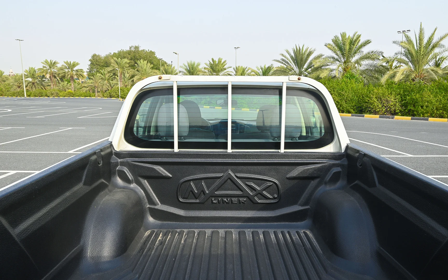 Used 2018 Mitsubishi L200 GL Double Cabin in White – Boot / Trunk Space Open View for Sale at First Choice Cars Dubai Sharjah