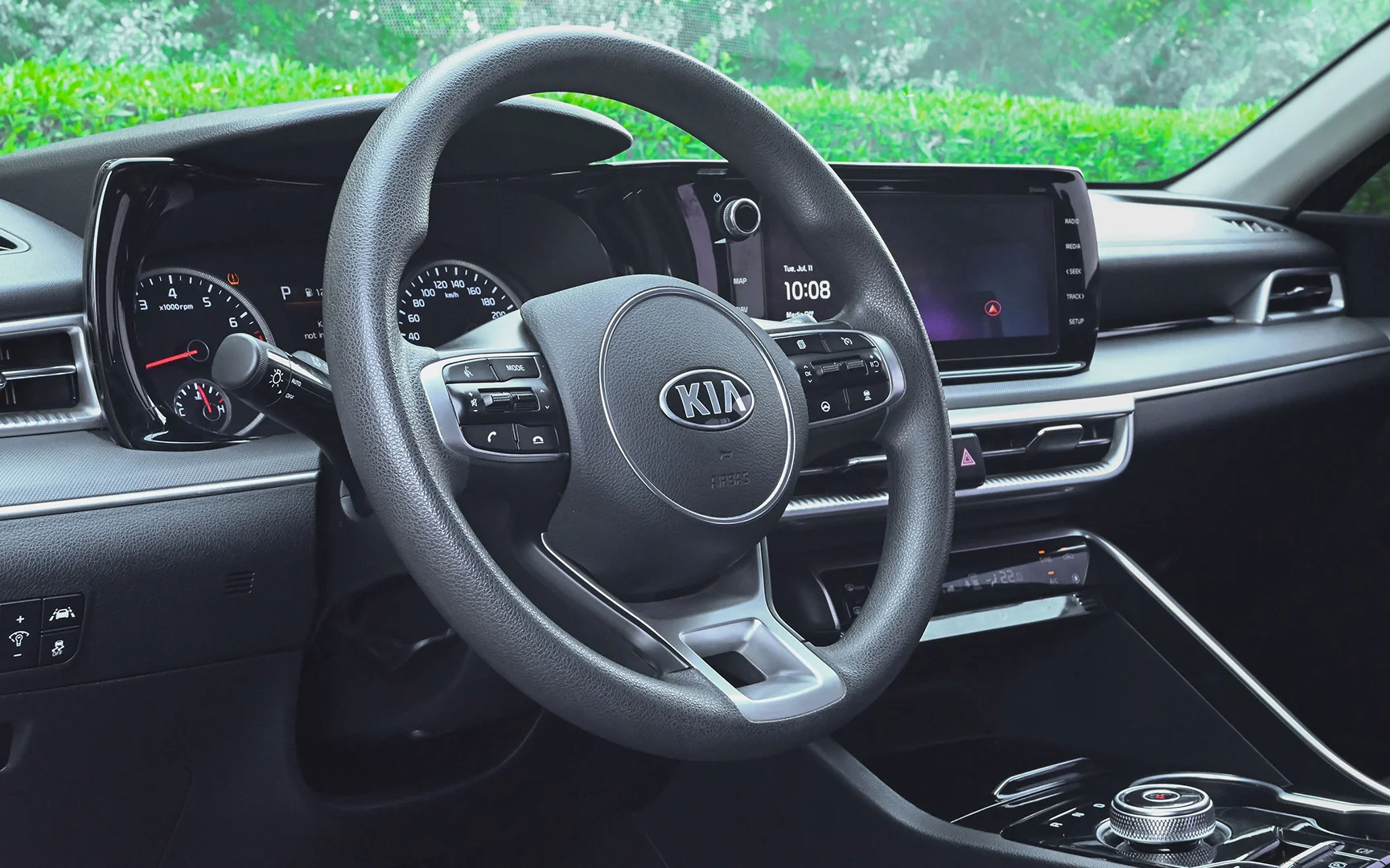 Used 2020 Kia K5 LX in White – Driver Side Dashboard & Steering View for Sale at First Choice Cars Dubai Sharjah