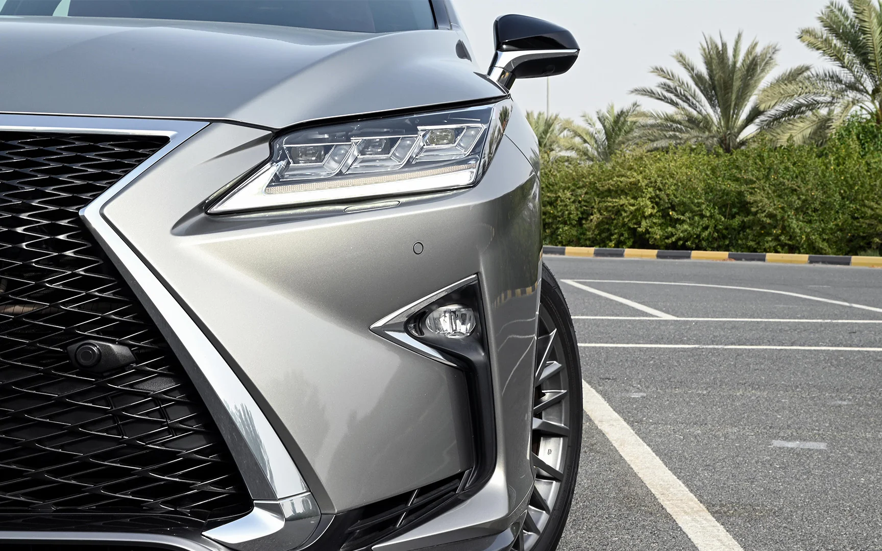Used 2017 Lexus RX-Series RX 450h L Platinum in Silver – Headlight Close-up for Sale at First Choice Cars Dubai Sharjah