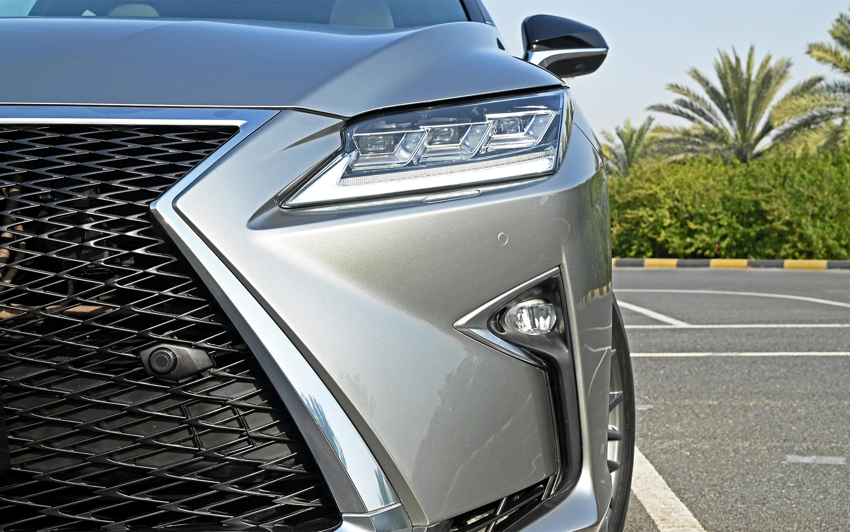 Used 2017 Lexus RX-Series RX 450h F Sport Silver – Headlight Close-up at First Choice Cars Sharjah