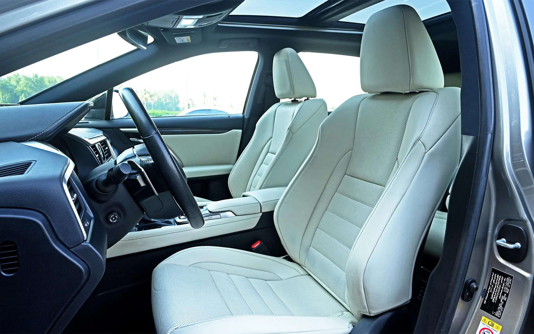 Used 2017 Lexus RX-Series RX 450h F Sport Silver – Front Driver Side Cabin View at First Choice Cars Sharjah