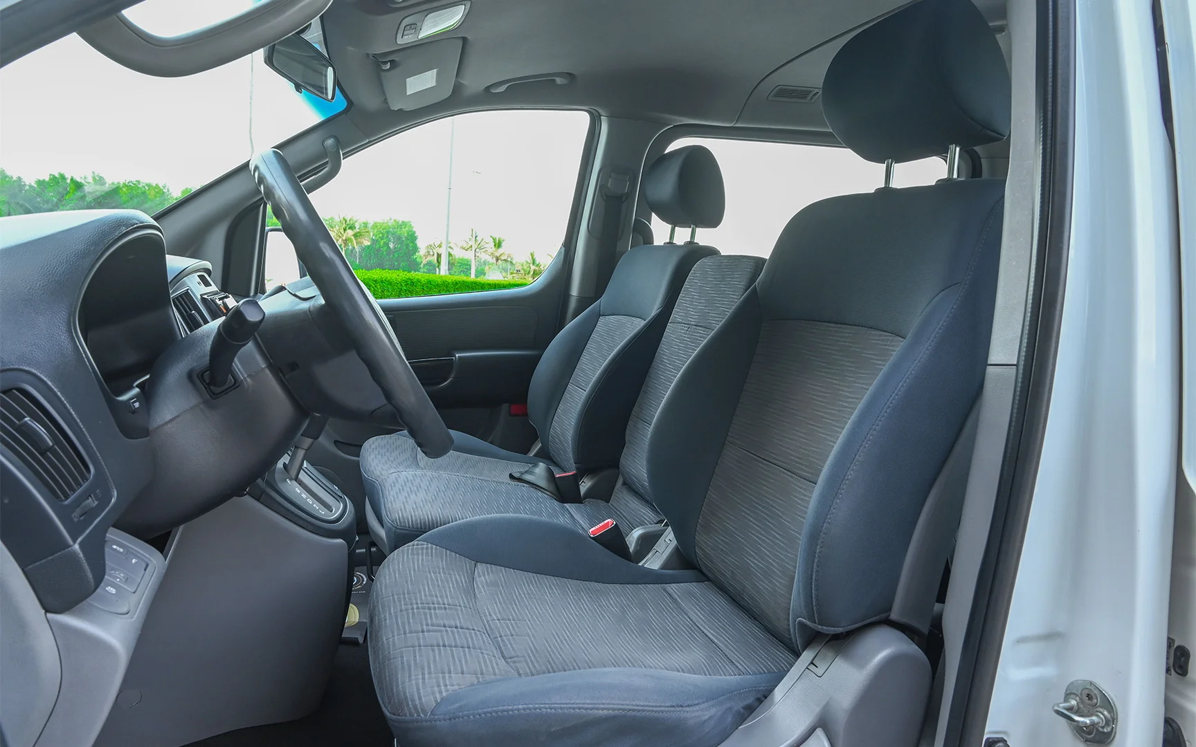 Used 2018 Hyundai H1 12-Seater Wagon White – Front Driver Side Cabin View at First Choice Cars Sharjah