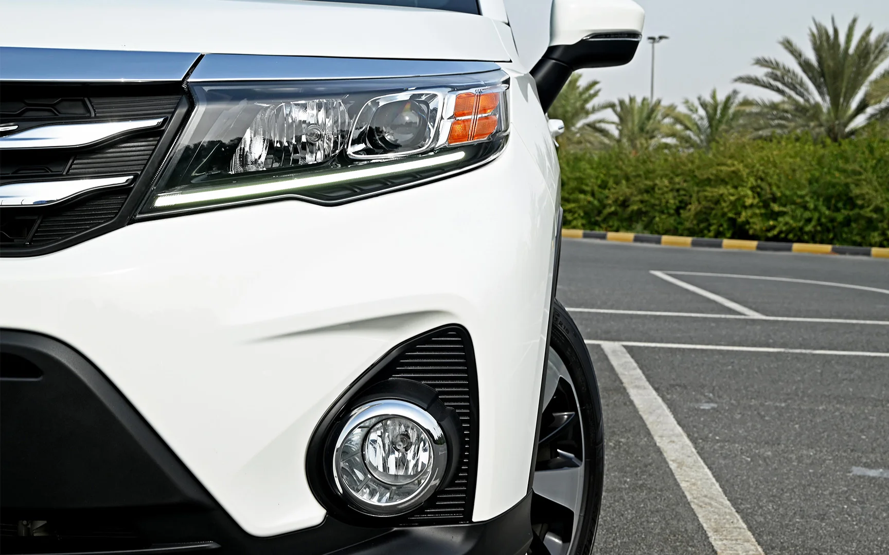 Used 2022 GAC GS3 GE White – Headlight Close-up at First Choice Cars Sharjah