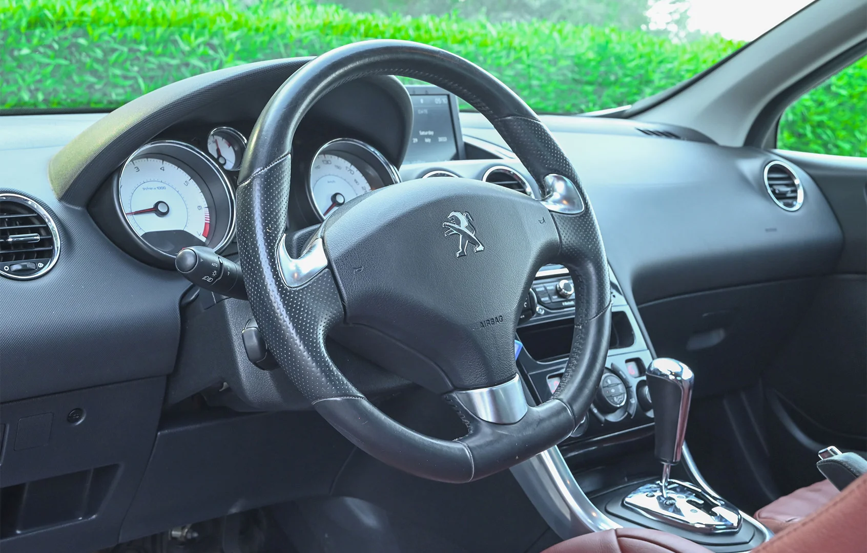 Used 2014 Peugeot 308 CC Convertible White – Driver Side Dashboard & Steering View at First Choice Cars Sharjah