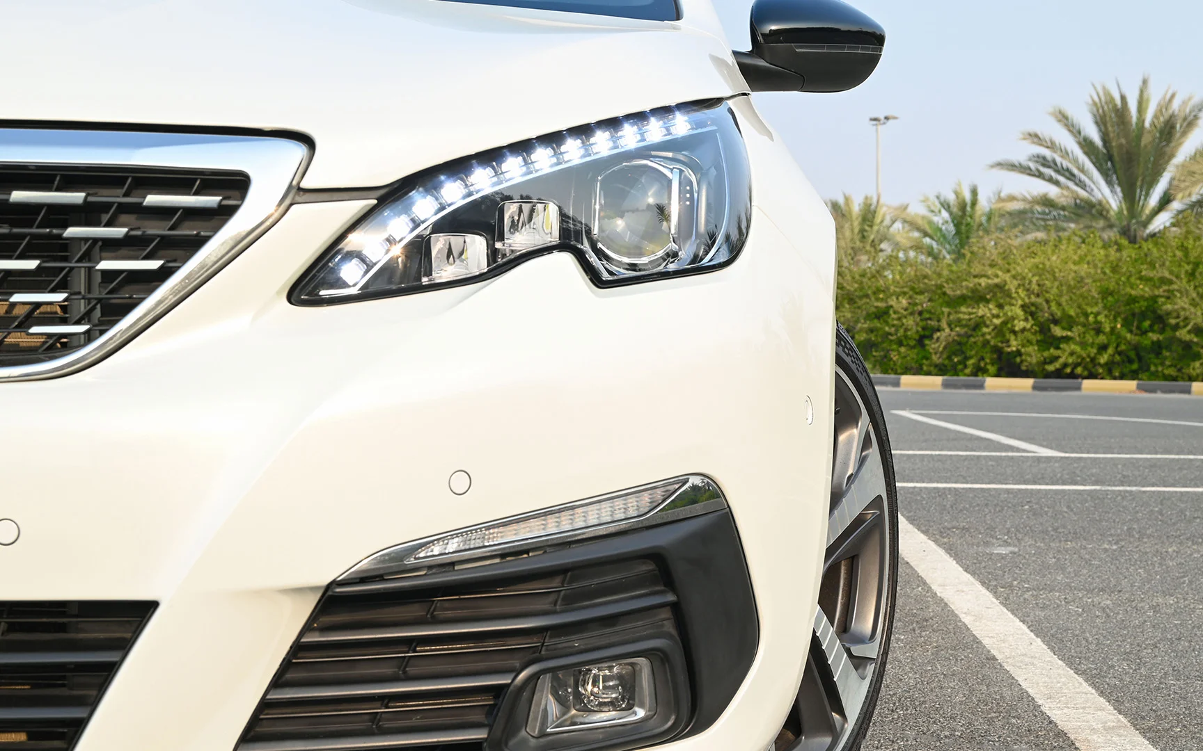 Used 2018 Peugeot 308 GT Line White – Headlight Close-up at First Choice Cars Sharjah