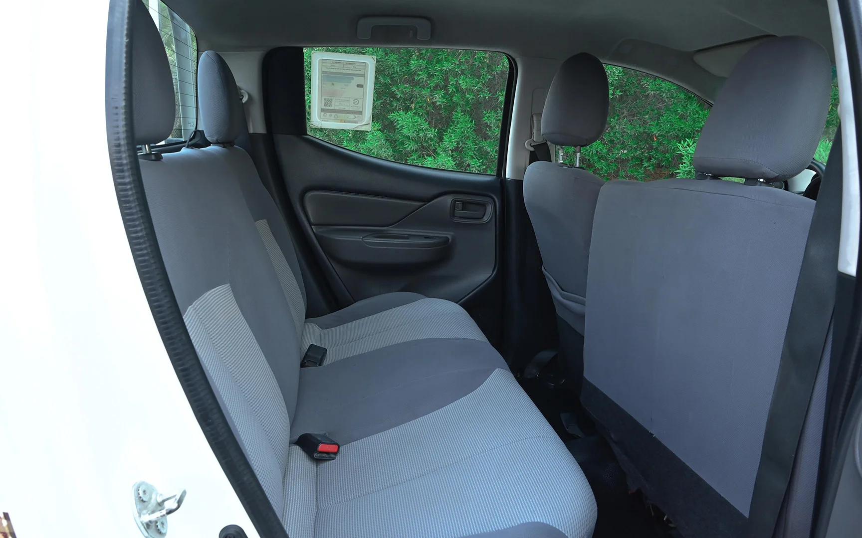 Used 2018 Mitsubishi L200 GL Double Cabin White – Rear Passenger Side Cabin View at First Choice Cars Sharjah