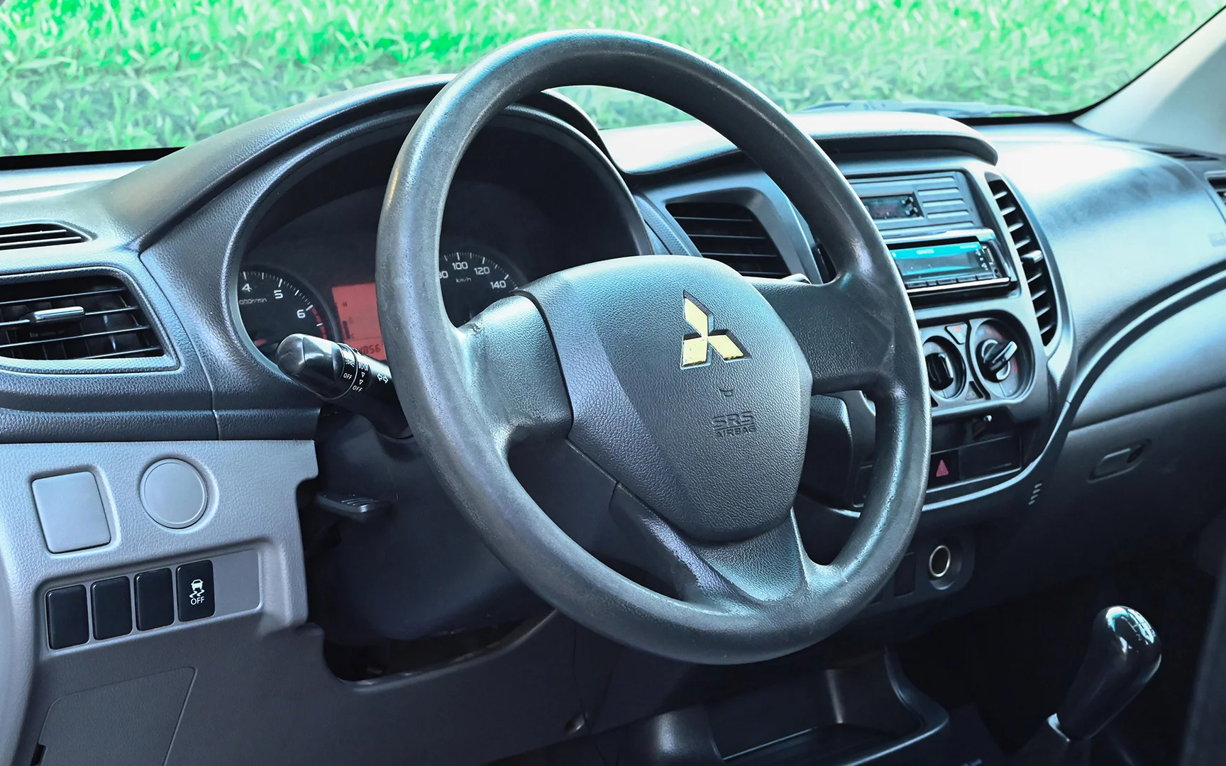 Used 2018 Mitsubishi L200 GL Double Cabin White – Driver Side Dashboard & Steering View at First Choice Cars Sharjah