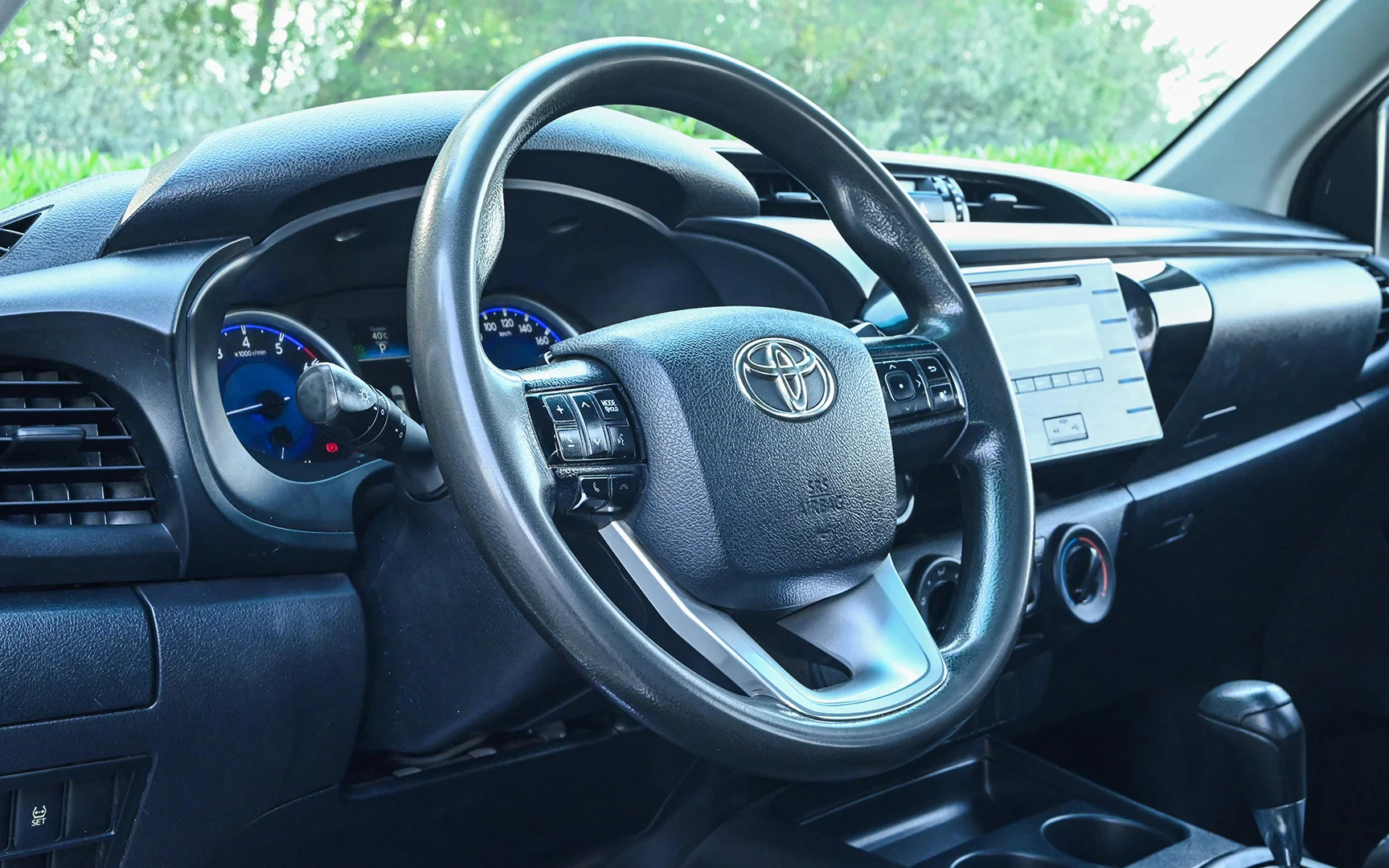 Used 2018 Toyota Hilux GLX Double Cabin White – Driver Side Dashboard & Steering View at First Choice Cars Sharjah