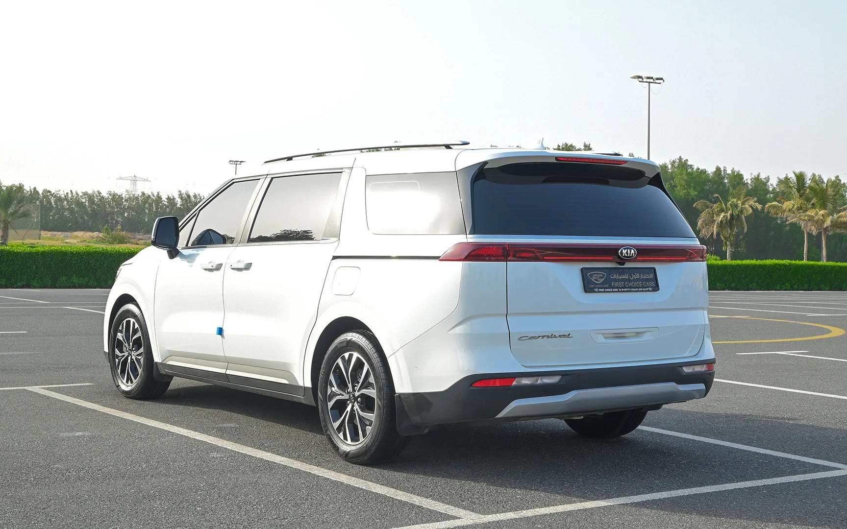 Used 2021 KIA Carnival Lx White – Left Back Diagonal (45°) View at First Choice Cars Sharjah