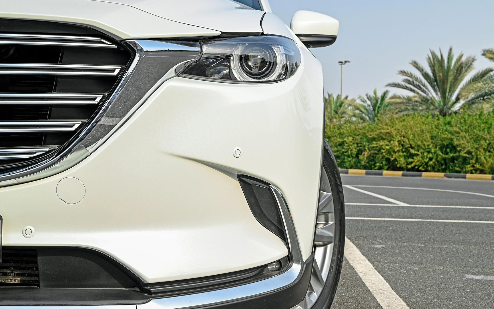 Used 2018 Mazda CX-9 Limited White – Headlight Close-up at First Choice Cars Sharjah