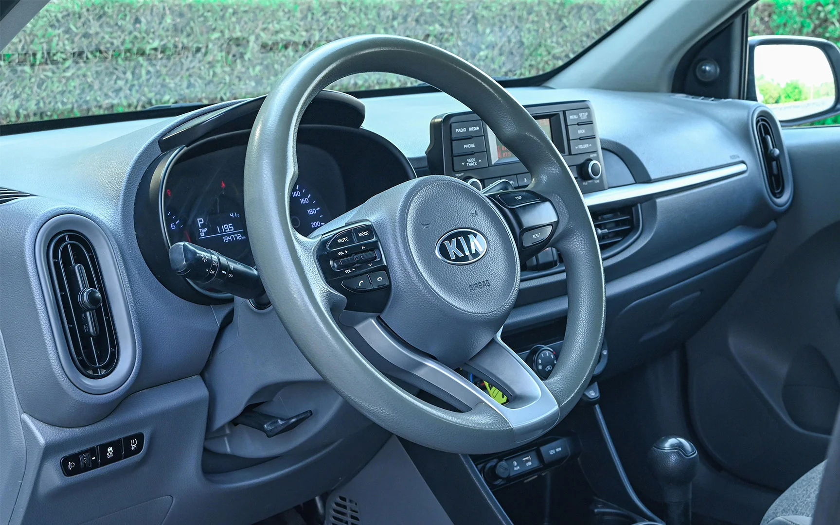 Used 2019 KIA Picanto LX White – Driver Side Dashboard & Steering View at First Choice Cars Sharjah