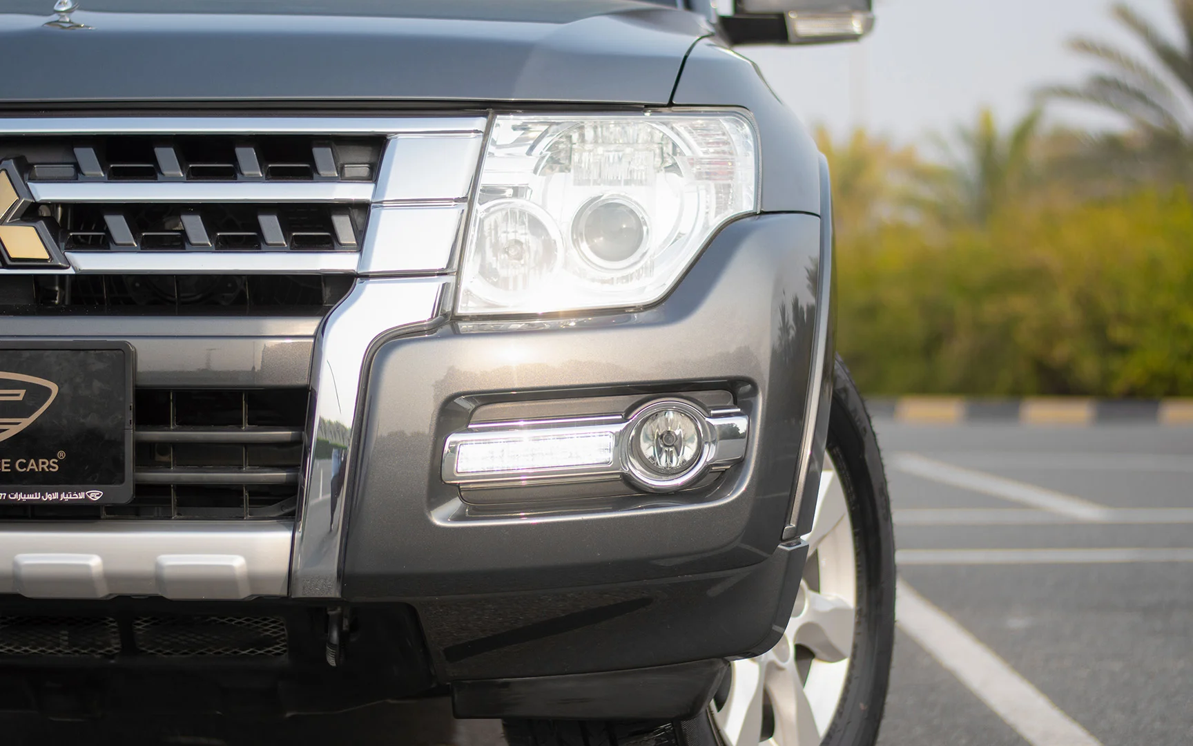 Used 2019 Mitsubishi PAJERO GLS Grey – Headlight Close-up at First Choice Cars Sharjah