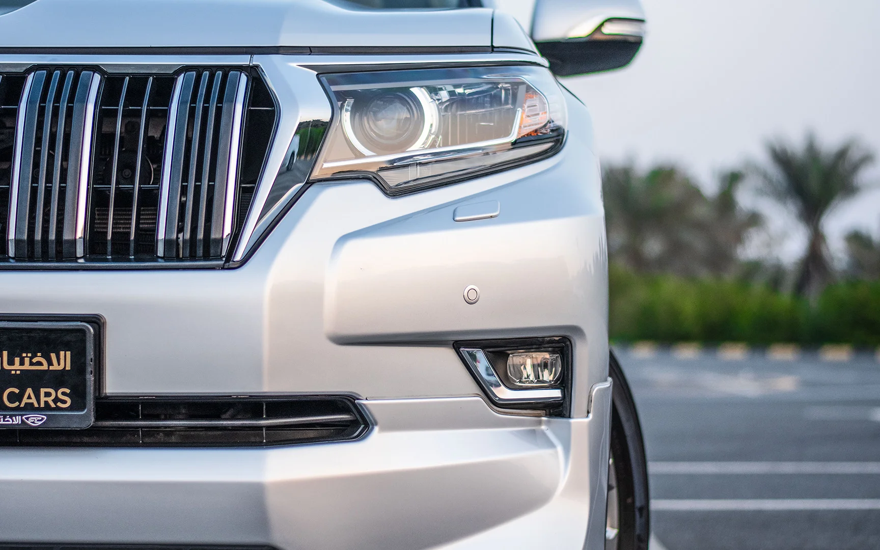 Used 2019 Toyota Prado VXR Silver – Headlight Close-up at First Choice Cars Sharjah
