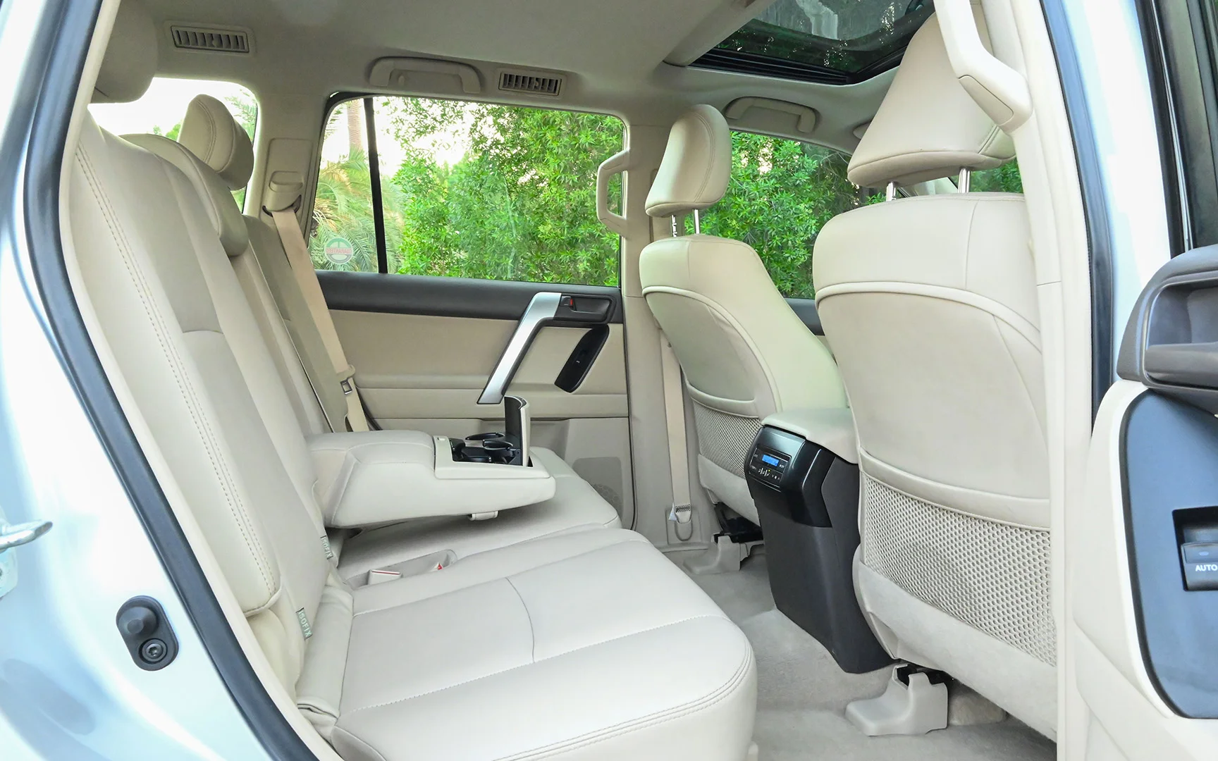 Used 2019 Toyota Prado VXR Silver – Rear Passenger Side Cabin View at First Choice Cars Sharjah