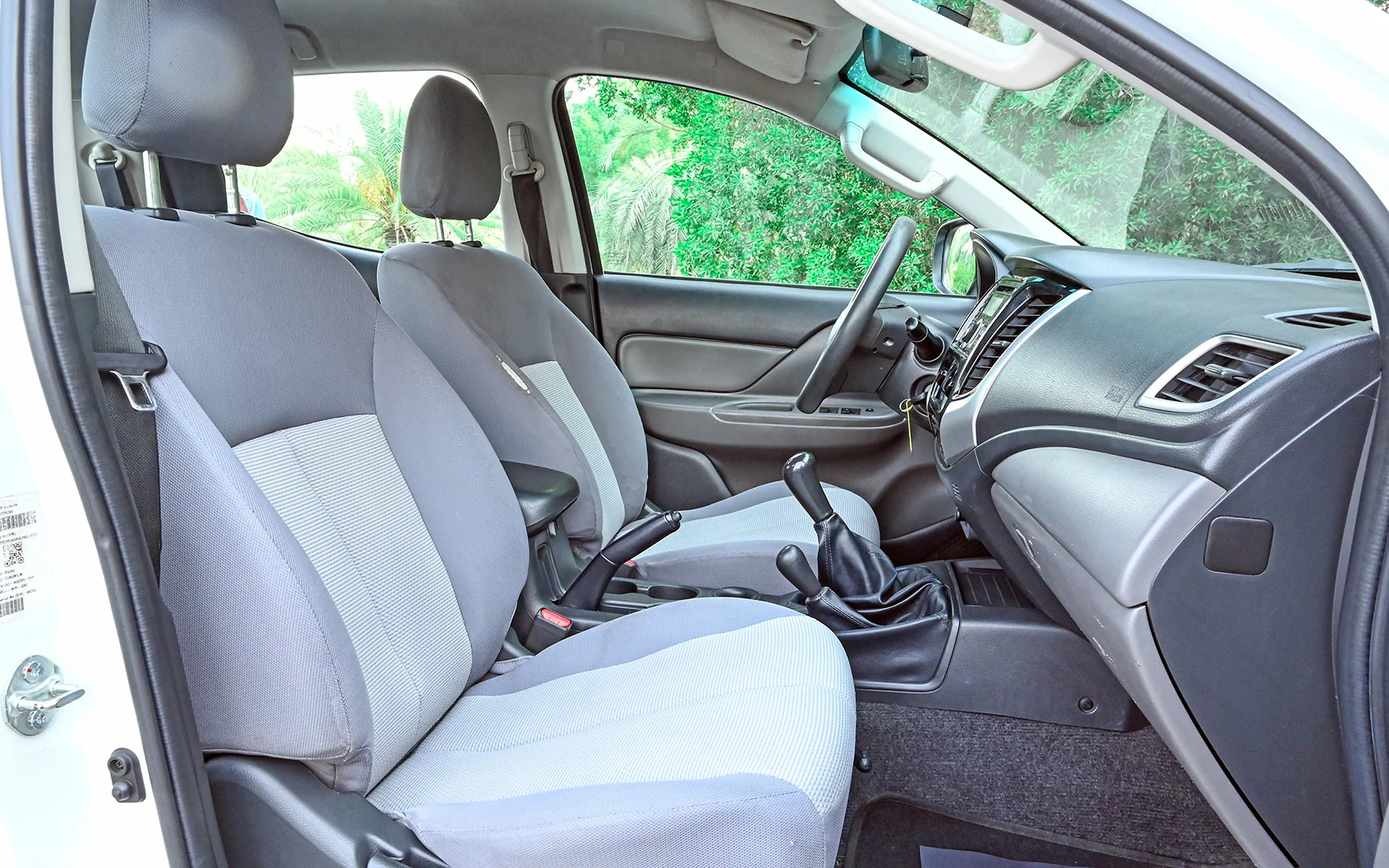 Used 2018 Mitsubishi L200 GLX Double Cabin White – Front Passenger Side Cabin View at First Choice Cars Sharjah