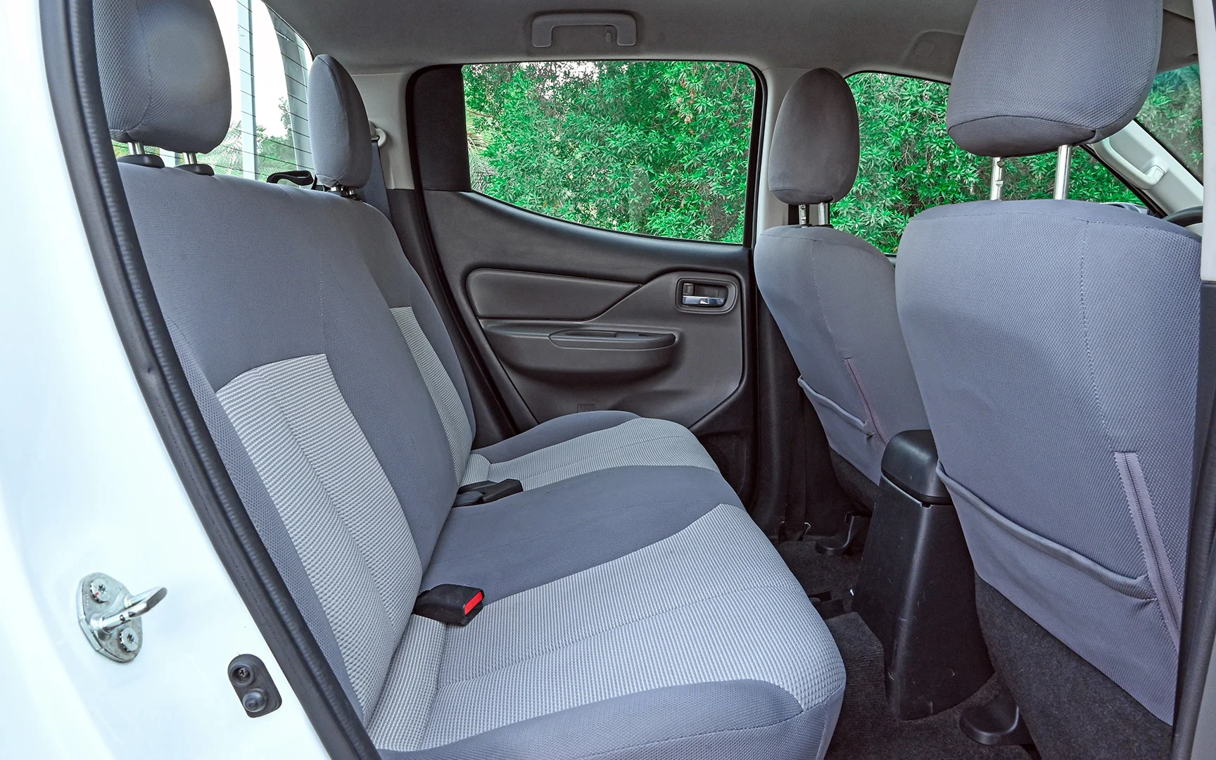 Used 2018 Mitsubishi L200 GLX Double Cabin White – Rear Passenger Side Cabin View at First Choice Cars Sharjah