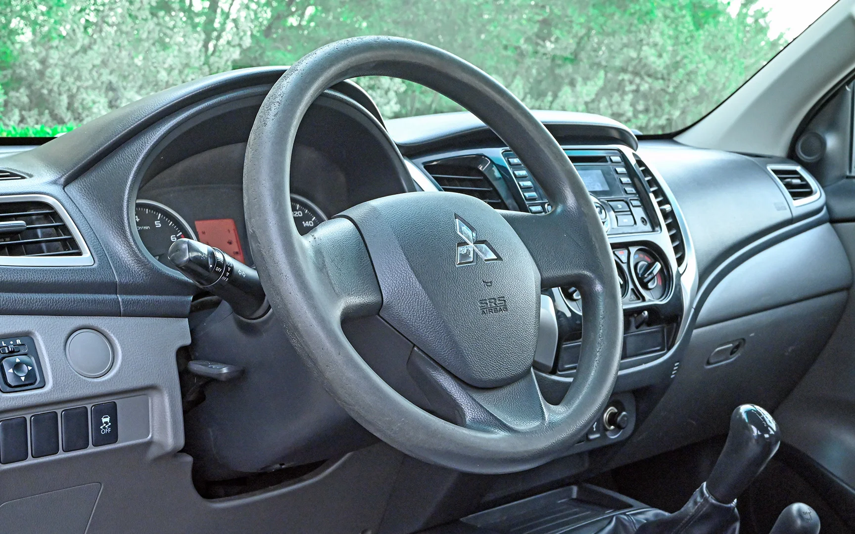 Used 2018 Mitsubishi L200 GLX Double Cabin White – Driver Side Dashboard & Steering View at First Choice Cars Sharjah