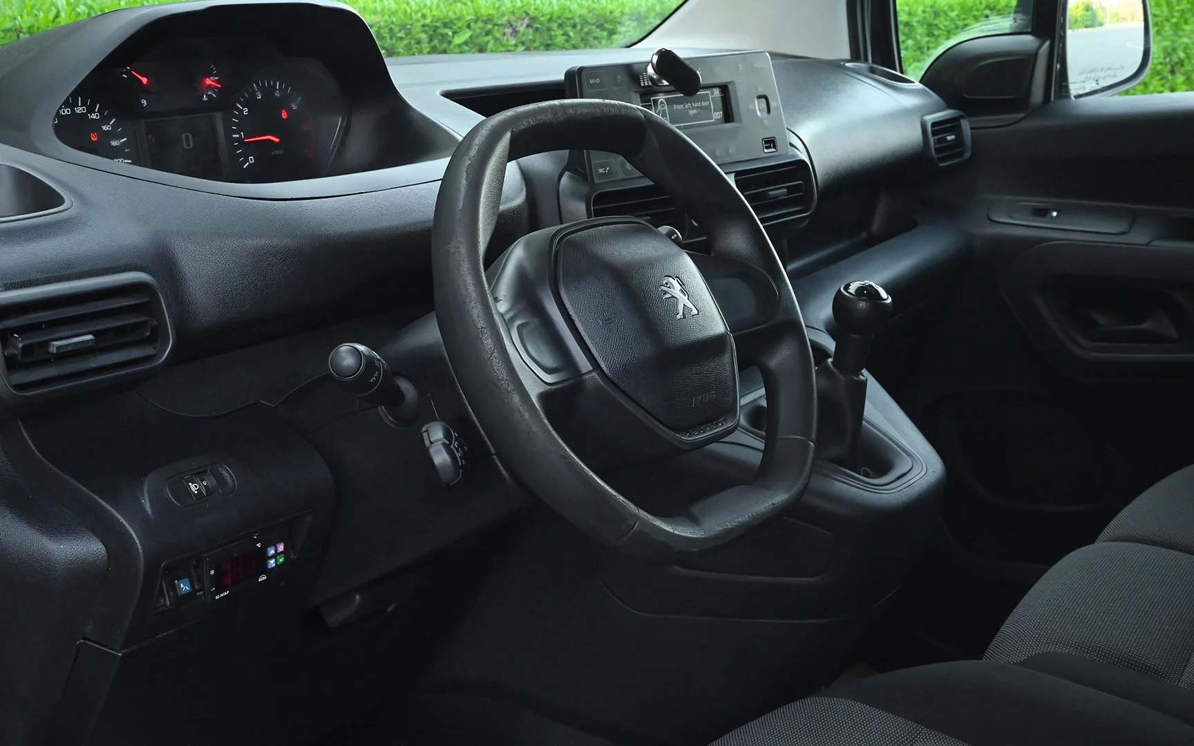 Used 2020 Peugeot Partner Long Van in White – Driver Side Dashboard & Steering View for Sale at First Choice Cars Dubai Sharjah