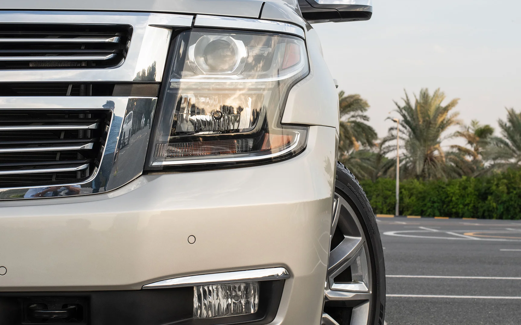 Used 2015 Chevrolet Tahoe LTZ Gold – Headlight Close-up at First Choice Cars Sharjah