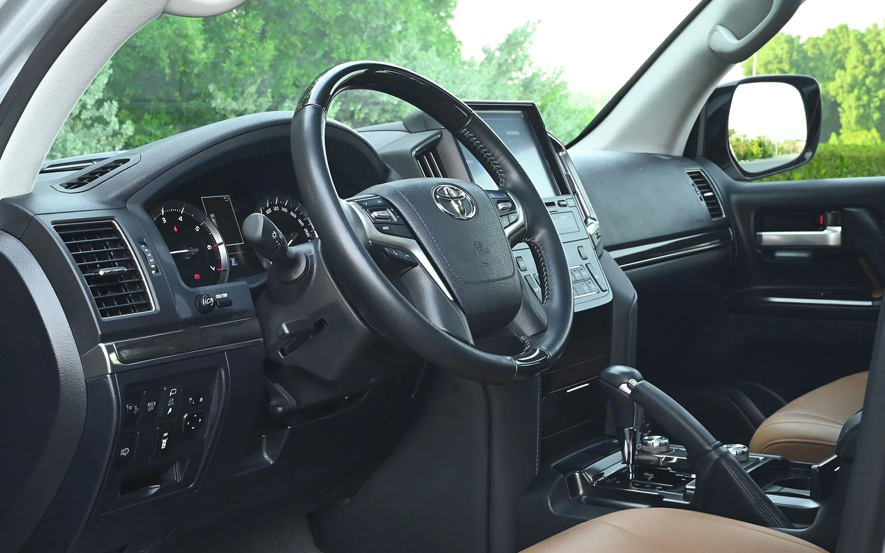 Used 2021 Toyota Land Cruiser GXR Silver – Driver Side Dashboard & Steering View at First Choice Cars Sharjah