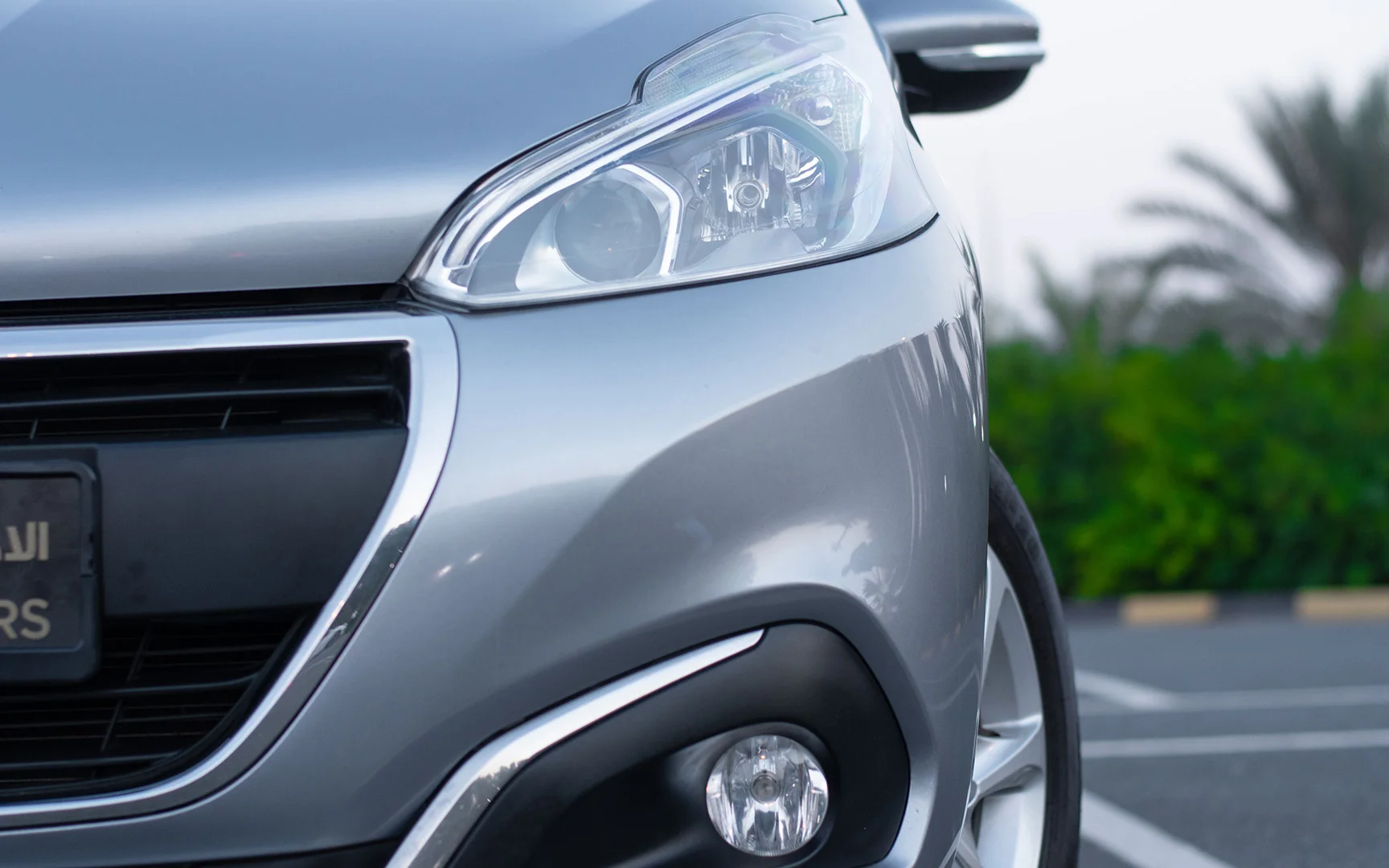 Used 2019 Peugeot 208 Active Silver – Headlight Close-up at First Choice Cars Sharjah