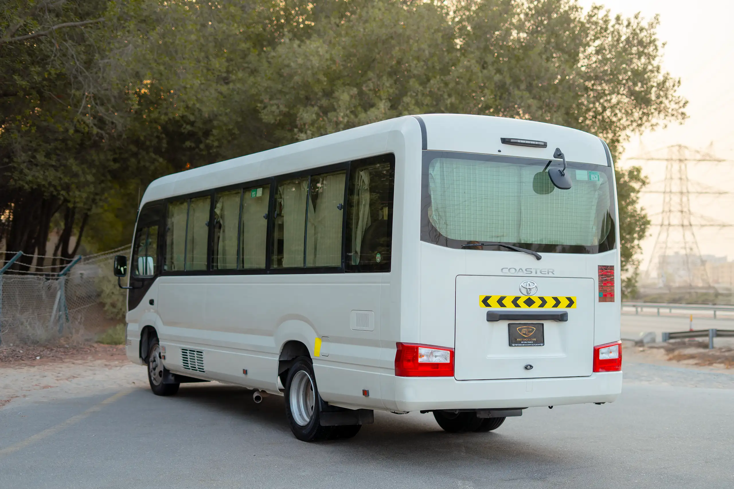 Used 2020 Toyota Coaster High Roof in White – Right Back Diagonal (45°) View for Sale at First Choice Cars Dubai Sharjah