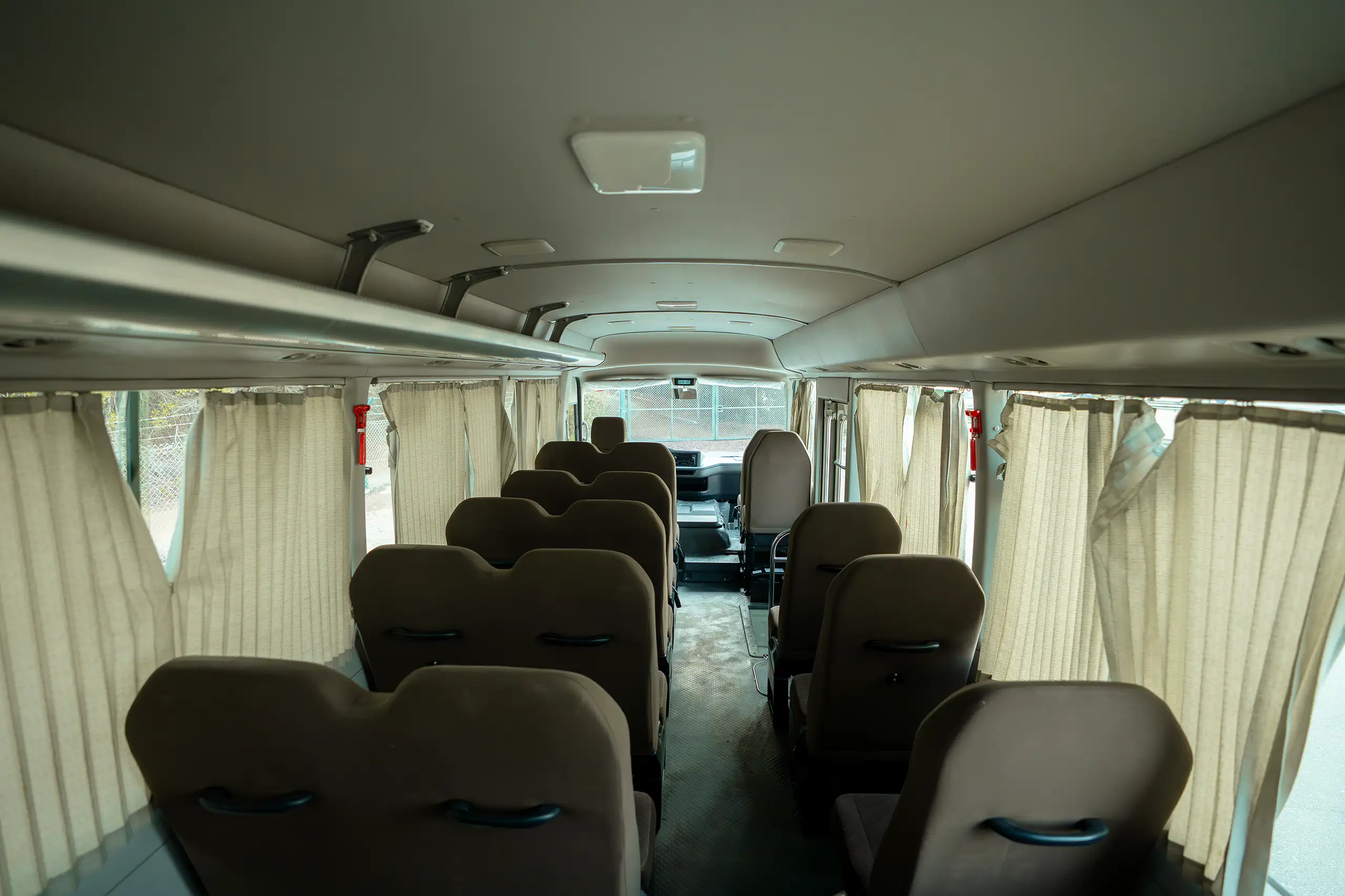 Used 2020 Toyota Coaster High Roof in White – Rear Seat View for Sale at First Choice Cars Dubai Sharjah